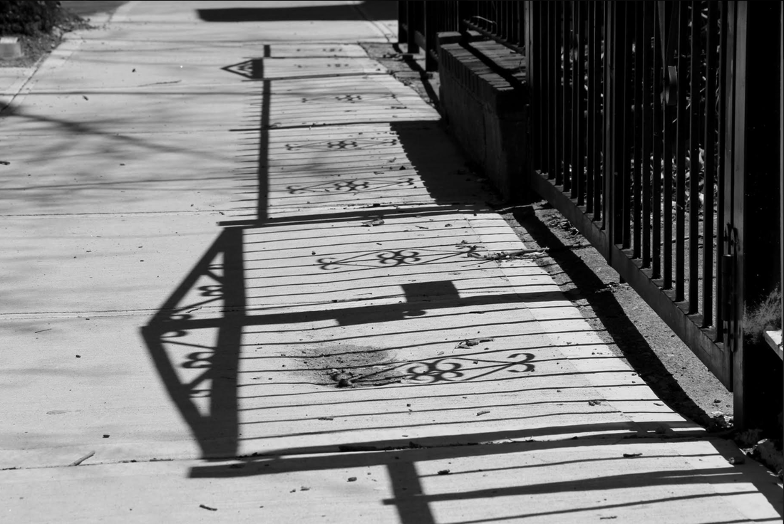 Shadow of a gate on the ground